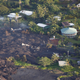 Image for article titled New aerial photos show Kilauea’s lava devouring neighborhoods